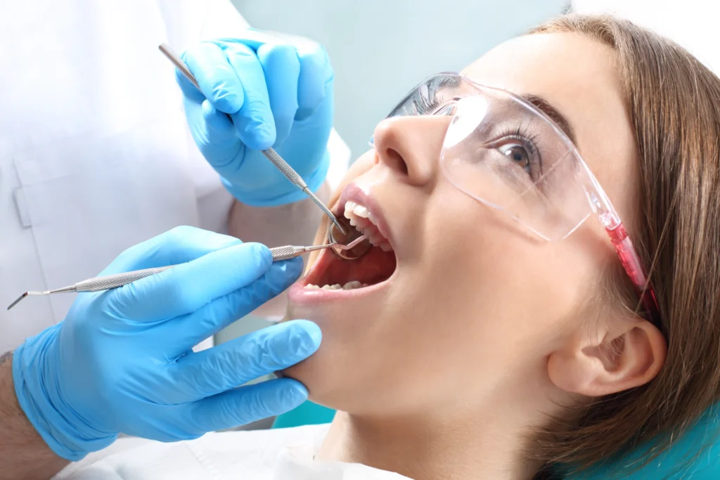 Overview of dental caries prevention.Woman at the dentist's chair during a dental procedure